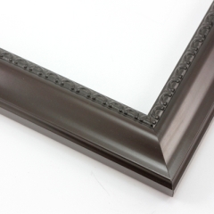 This shallow reverse scoop frame features a smooth face in a dark walnut wash with a subtle view of the natural wood grain. The inner lip is a horseshoe relief design in black, and the outer edge has a slight bevel.

1.5 " width: ideal for medium size artwork.  The simple elegance of this frame makes it the perfect border for photographs, paintings and giclee prints.