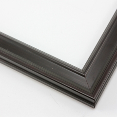 This narrow frame features a crown moulding profile finished in a deep plum wash.  The steeply bevelled edges are naturally highlighted for a modern look. 

1.25 " width: ideal for small- to medium-size images.  Border a white-dominant grayscale photograph or watercolour painting with this stylishly simple frame.